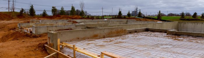 New homes in the process of being built with foundations in the foreground